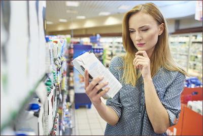 Woman reading food label