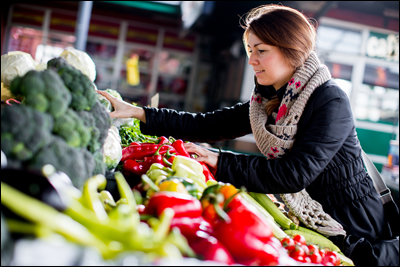 Woman buying vegetables