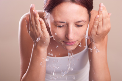 Woman washing face