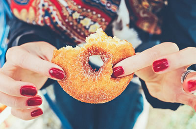 Woman eating a donut