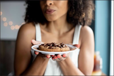 Woman offering Cookie