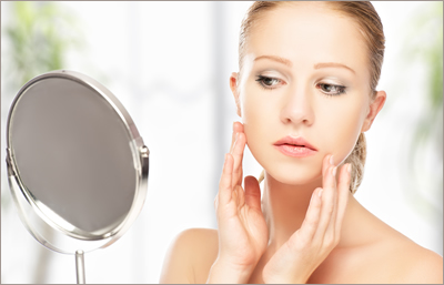 Woman looking in mirror